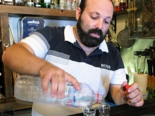 Konstantinos "Kostos" Aloupis sends us away with a raki Konstantinos "Kostos" Aloupis sends us away with a raki